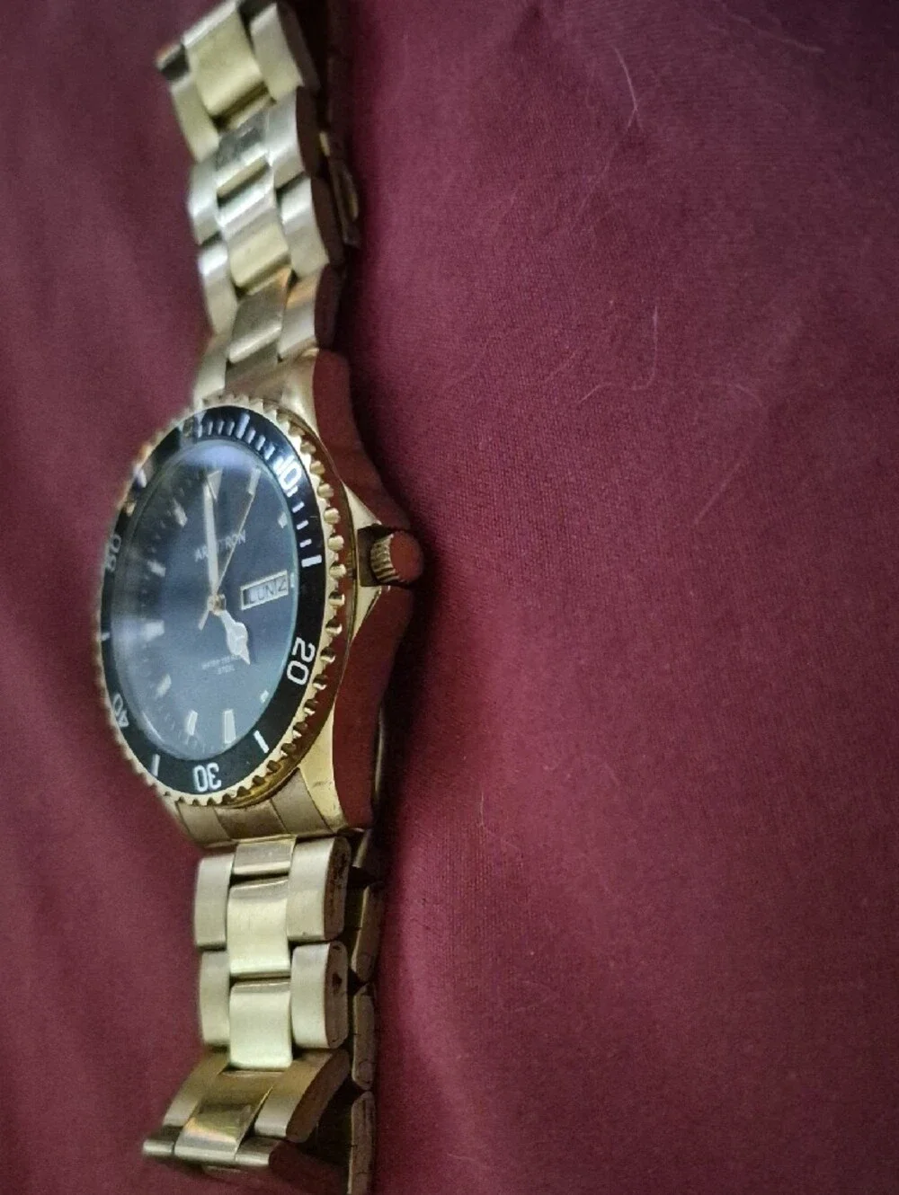 Armitron Gold-Tone Watch with Black Dial and Day-Date